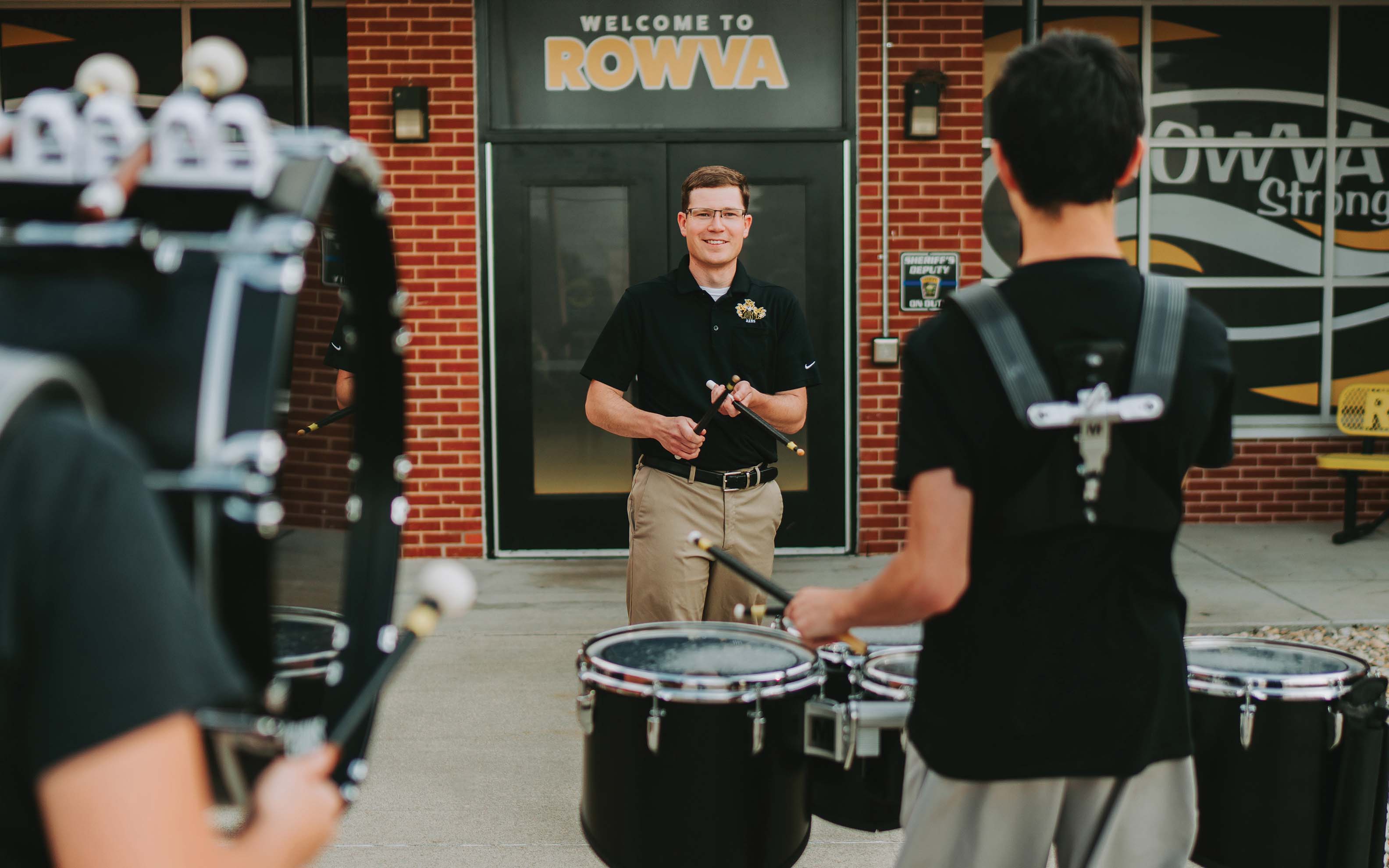 Anderson State Bank’s Cody Appell directs the ROWVA High band, which performs at community events. | Photo: Katelyn Turner