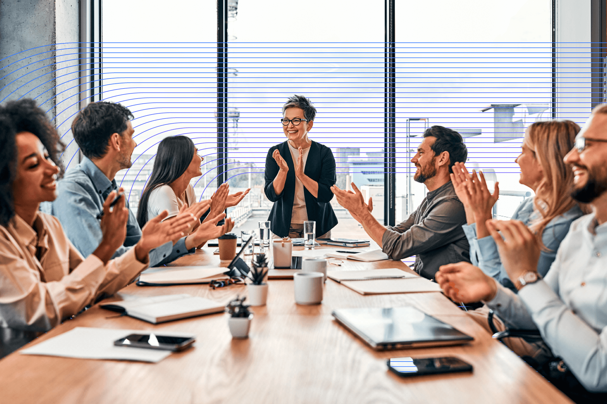 Group of people clapping on a meeting room