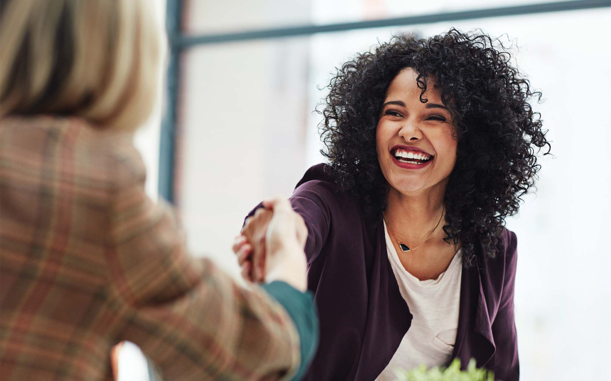 women shaking hands