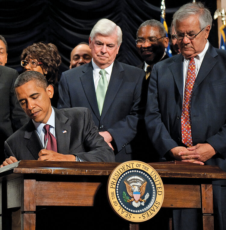 President Barak Obama signs the Dodd-Frank Act in 2010