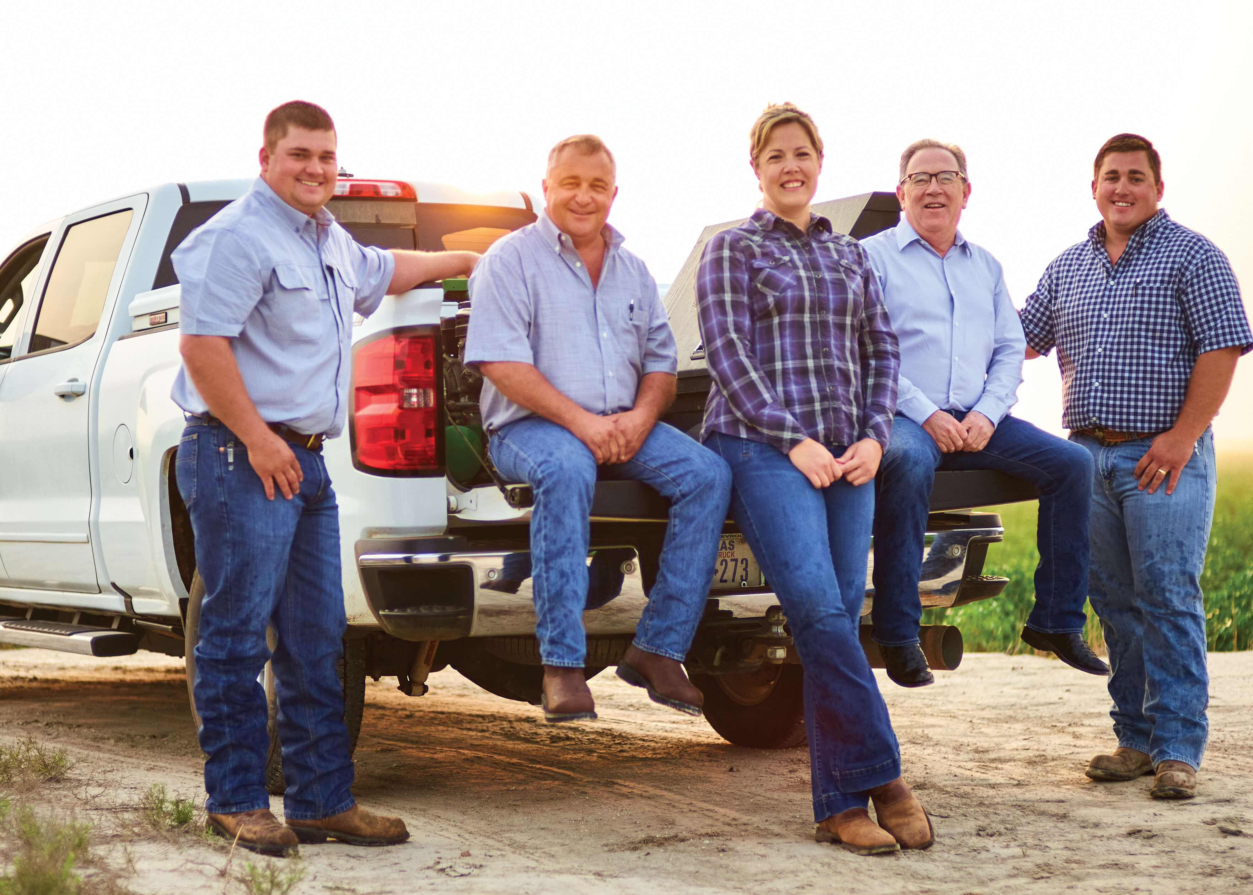 Guy Young and Alyssa Jones of First National Bank of Quitaque with Jeff George and his sons, Brennan and Gentry